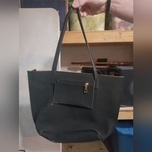 Browning bag with handgun holster inside. Black suede material.